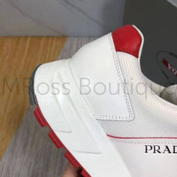 Белые кроссовки с красным задником Prada PRAX 1