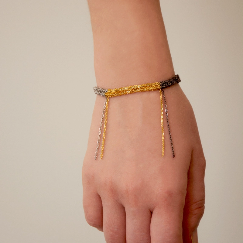 Плетенный браслет – Черная сталь, позолота