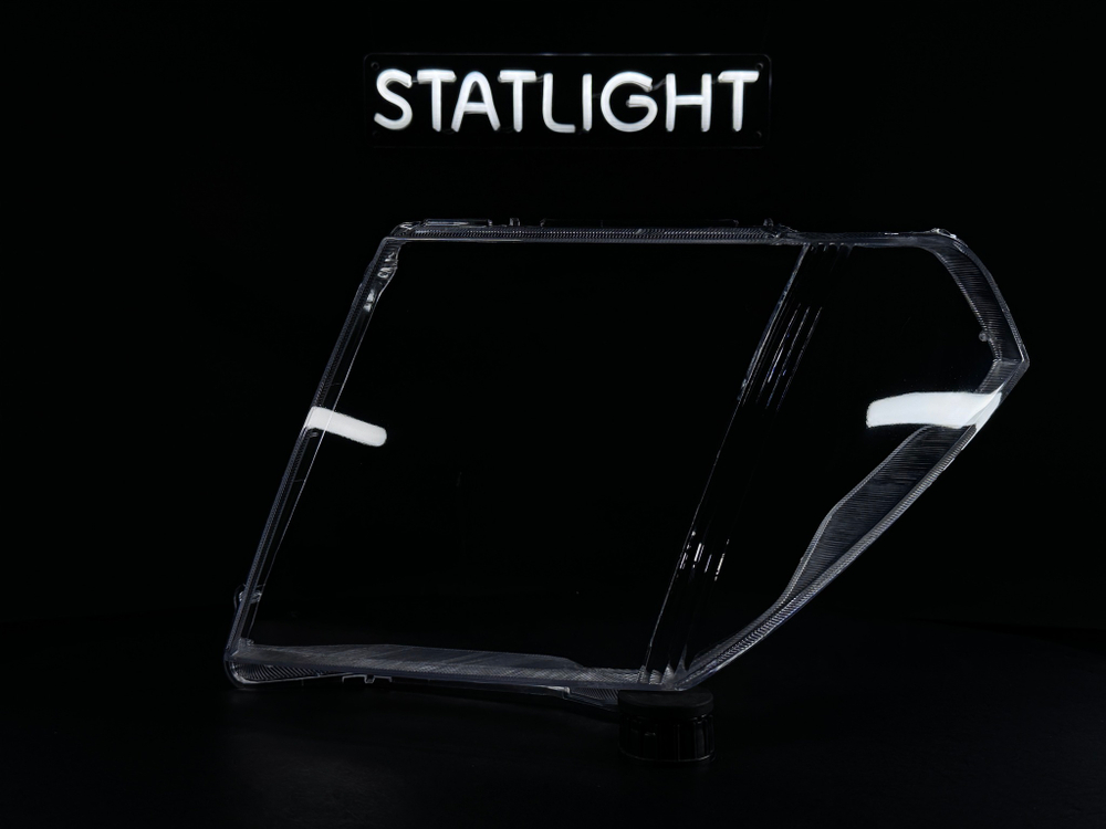 Левое стекло фары Nissan Navara Pathfinder R51 2004-2010