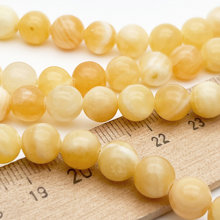 Кальцит желтый бусины, диаметр около 8,2-8,4 мм, цена за 22-23 шт (1/2 нити)