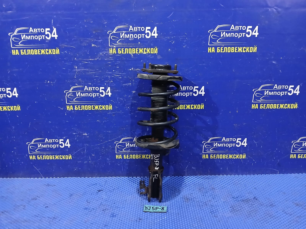 Стойка передняя левая MAZDA FAMILIA 2003