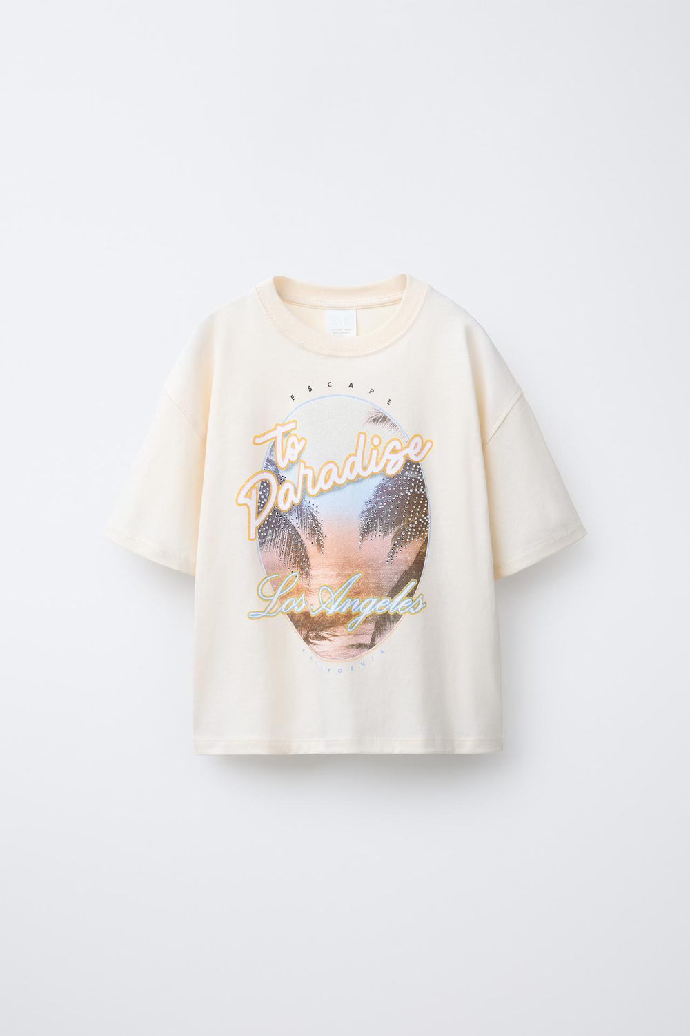 ZARA ФУТБОЛКА С ПРИНТОМ «ФЕСТИВАЛЬ» СО СТРАЗАМИ, ЭКРЮ