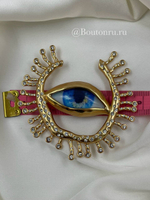Брошь Скиап. золотистая в форме глаза с подковой из ресниц со стразами