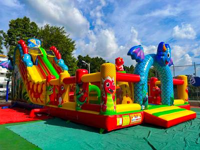 Коммерческий надувной батут «Драконы в тропиках» с механизированной головой, 14*7*7,3 м