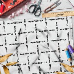 Ткань поплин стильная клетка из чёрных надписей на бежевом фоне