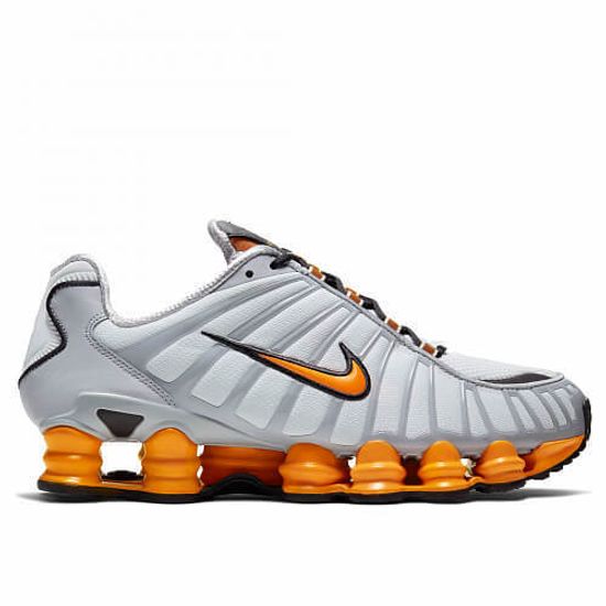 white and orange shox