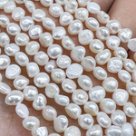 Жемчуг 2А речной бусины 6 мм, на нитке 38 см