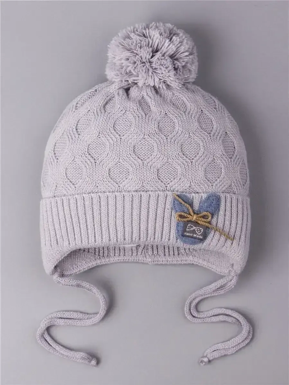 Шапка вязаная детская с бубоном на завязках