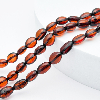 Янтарь бусины, галтовка темная, размер 10-11,6*7,1-8,4 мм, цена за 9 шт (1/4 нити)