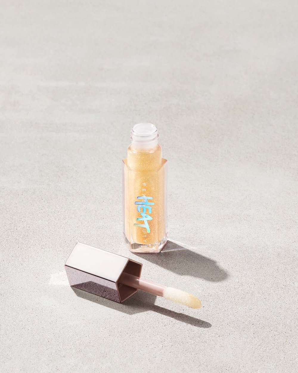 Блеск для губ Fenty beauty Gloss Bomb Heat Luminizer 05 lemon lava