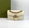 Стеганая мини-сумка Gucci GG Marmont белый