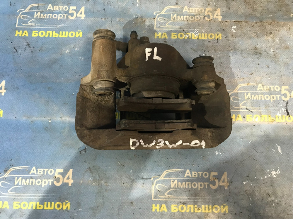 Суппорт тормозной передний левый MAZDA DEMIO 2001