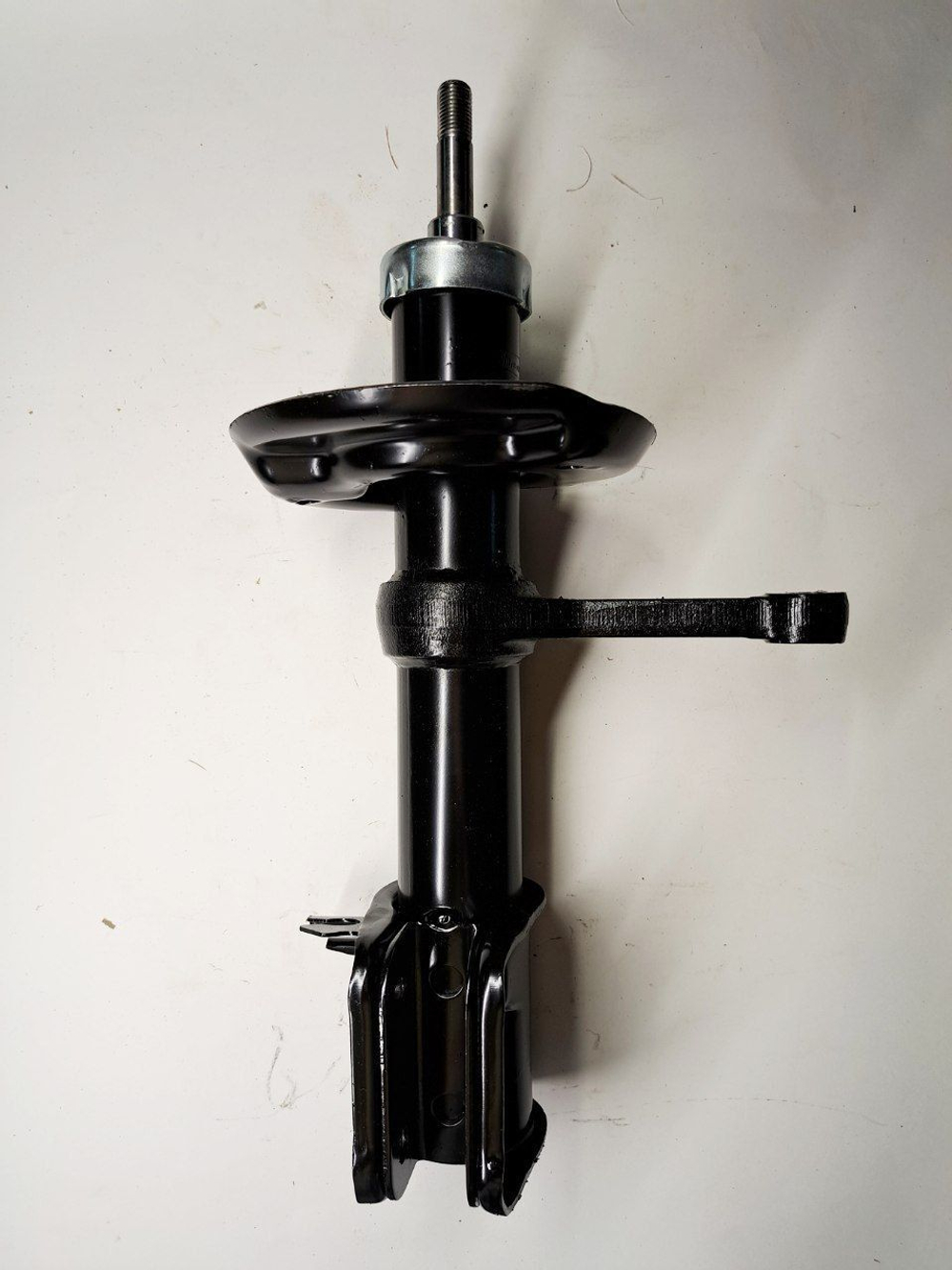 Стойка амортизатора передняя правая 1119-2905402 Птимаш