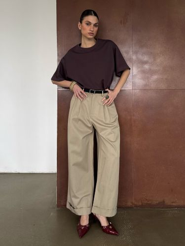 Бежевые хлопковые брюки-палаццо с защипами