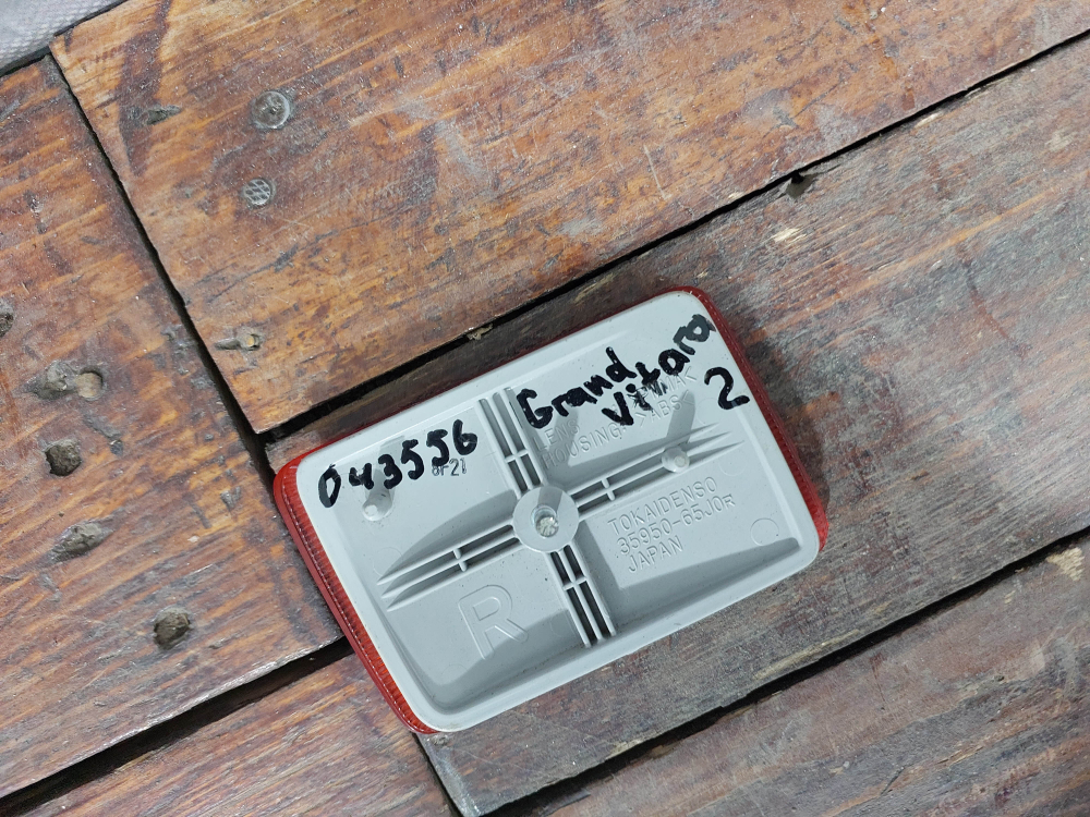 Катафот заднего бампера левый Suzuki Grand Vitara 2 (JT) 05-08 Б/У Оригинал 3595065J0