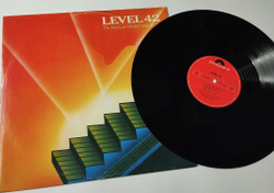 Винтажная виниловая пластинка LP Level 42 The Sun Goes Down (Living It Up) (UK 1983) 45 RPM Maxi Single