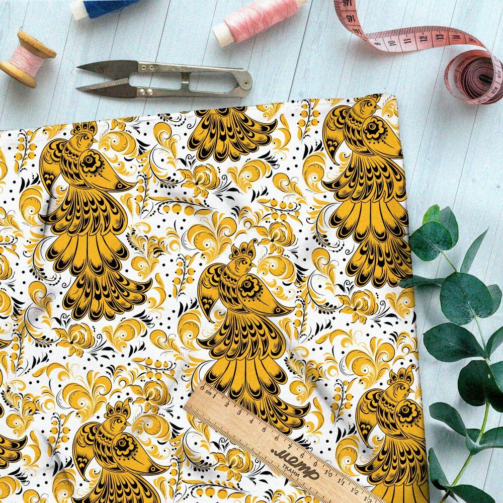 Ткань интерлок хохлома из золотых жар-птиц на белом фоне