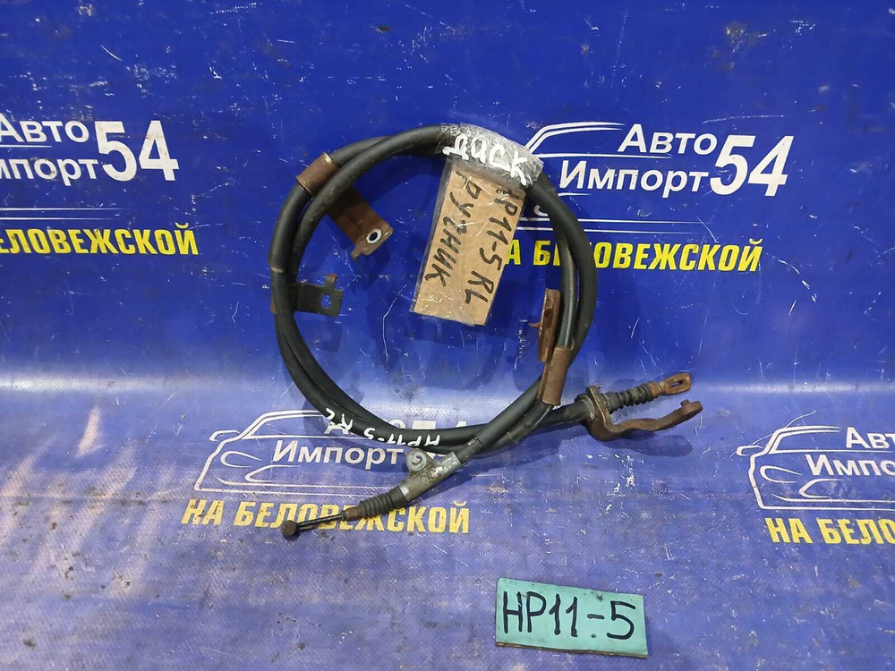 Трос ручника левый NISSAN PRIMERA 1998