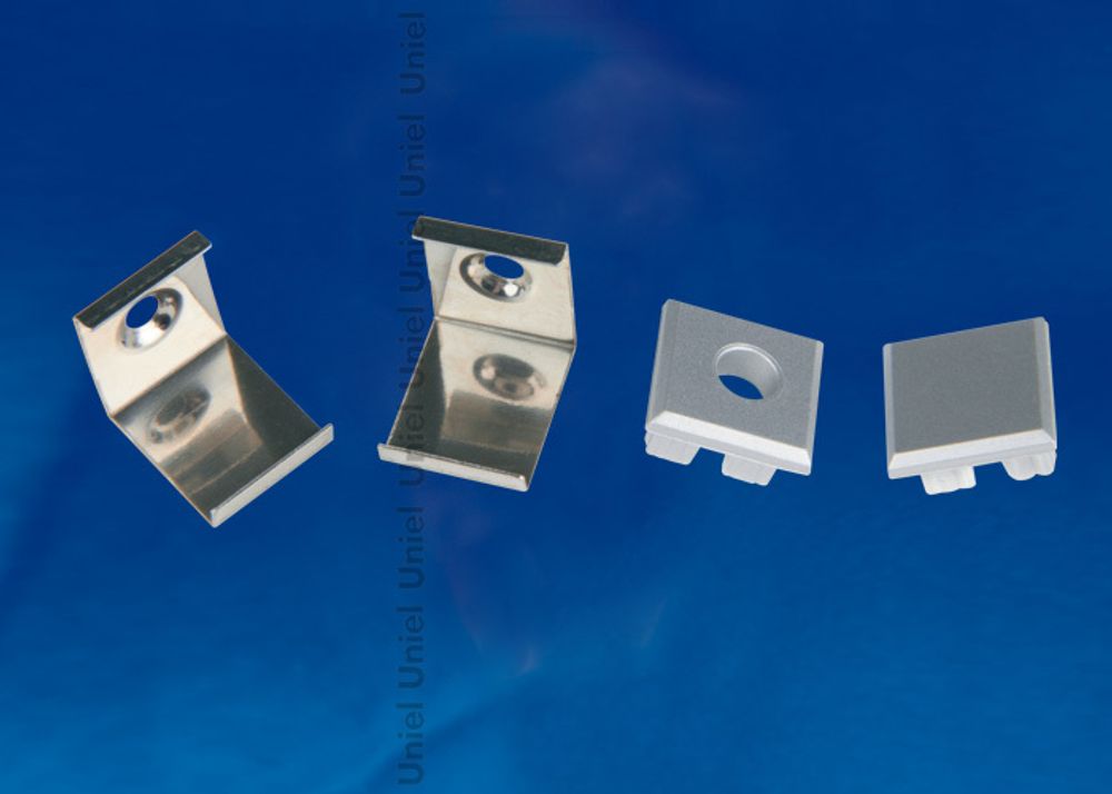 UFE-N05 SILVER A POLYBAG Набор аксессуаров для алюминиевого профиля. Крепежные скобы (4 шт., сталь) и заглушки (4 шт., пластик). Цвет серебро. ТМ Unie