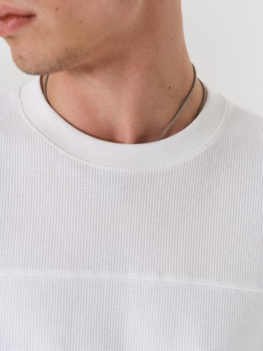 Белый хлопковый лонгслив Laine