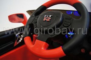 Детский электромобиль River Toys Nissan GTR X333XX красный