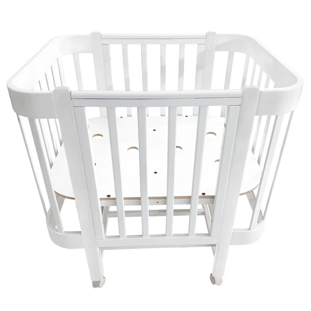 Кровать детская Indigo Italiano Baby продольный маятник на колесах белый-белый