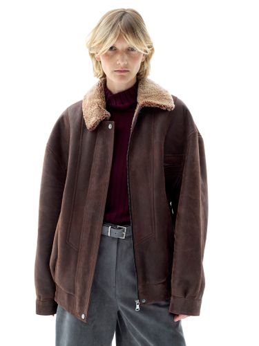 Коричневая кожаная оверсайз дубленка с отложным воротником
