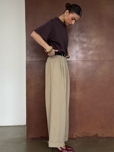 Бежевые хлопковые брюки-палаццо с защипами