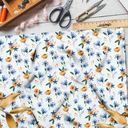 Ткань штапель оранжевые цветочки с голубыми листочками