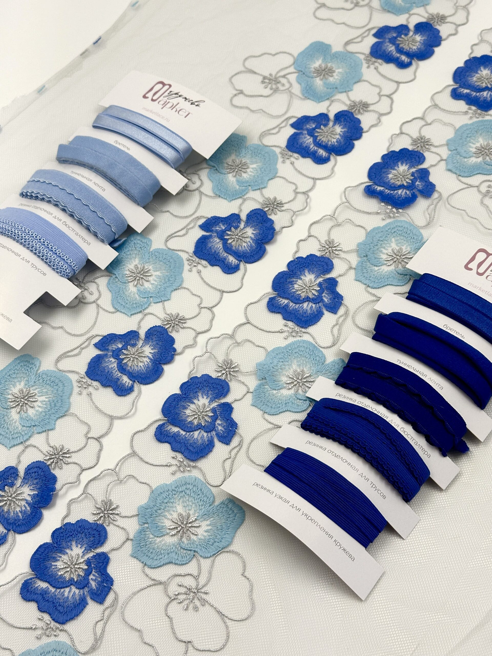 Вышивка на сетке светло-серая с синим и голубым ширина 22 см (2 стороны)