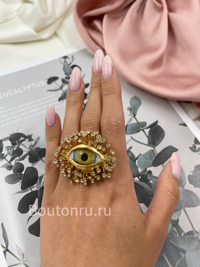 Кольцо Скиапар. крупное золотистое в форме глаза со стразами