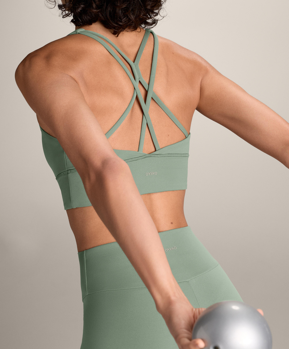 Oysho Спортивный бюстгальтер с бретелями на спине, бледно-зеленый