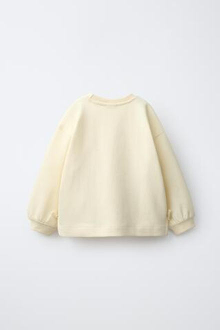 ZARA ТОЛСТОВКА С БАНТАМИ И СЕРДЦЕМ, ЦВЕТ СЛИВОЧНОГО МАСЛА