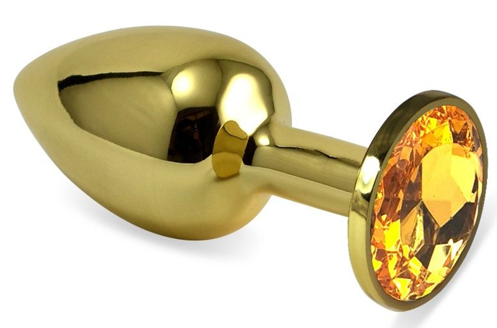Золотистая анальная пробка с оранжевым кристаллом - 6 см. (Цвет: оранжевый)