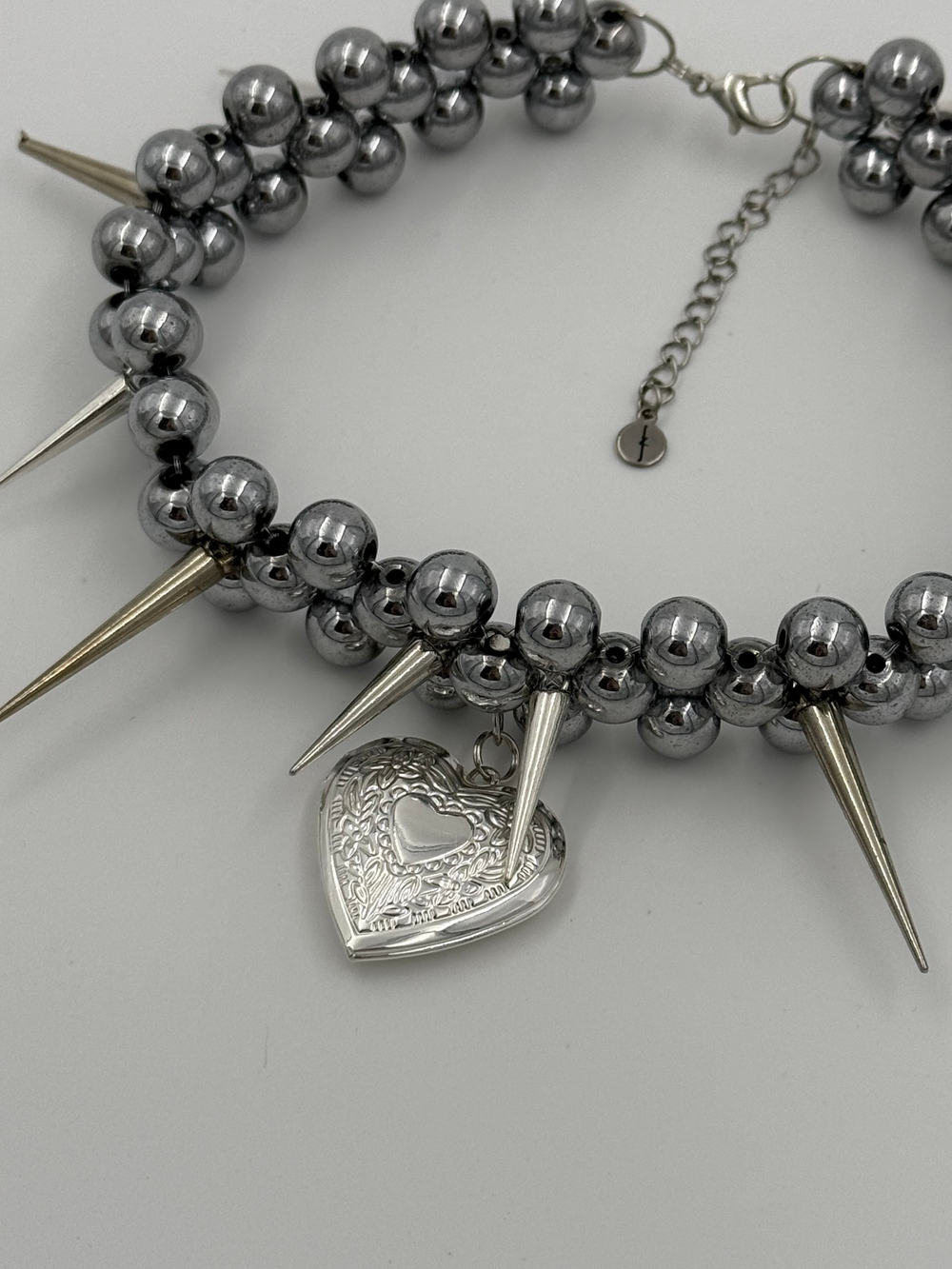 sharp medallion necklace