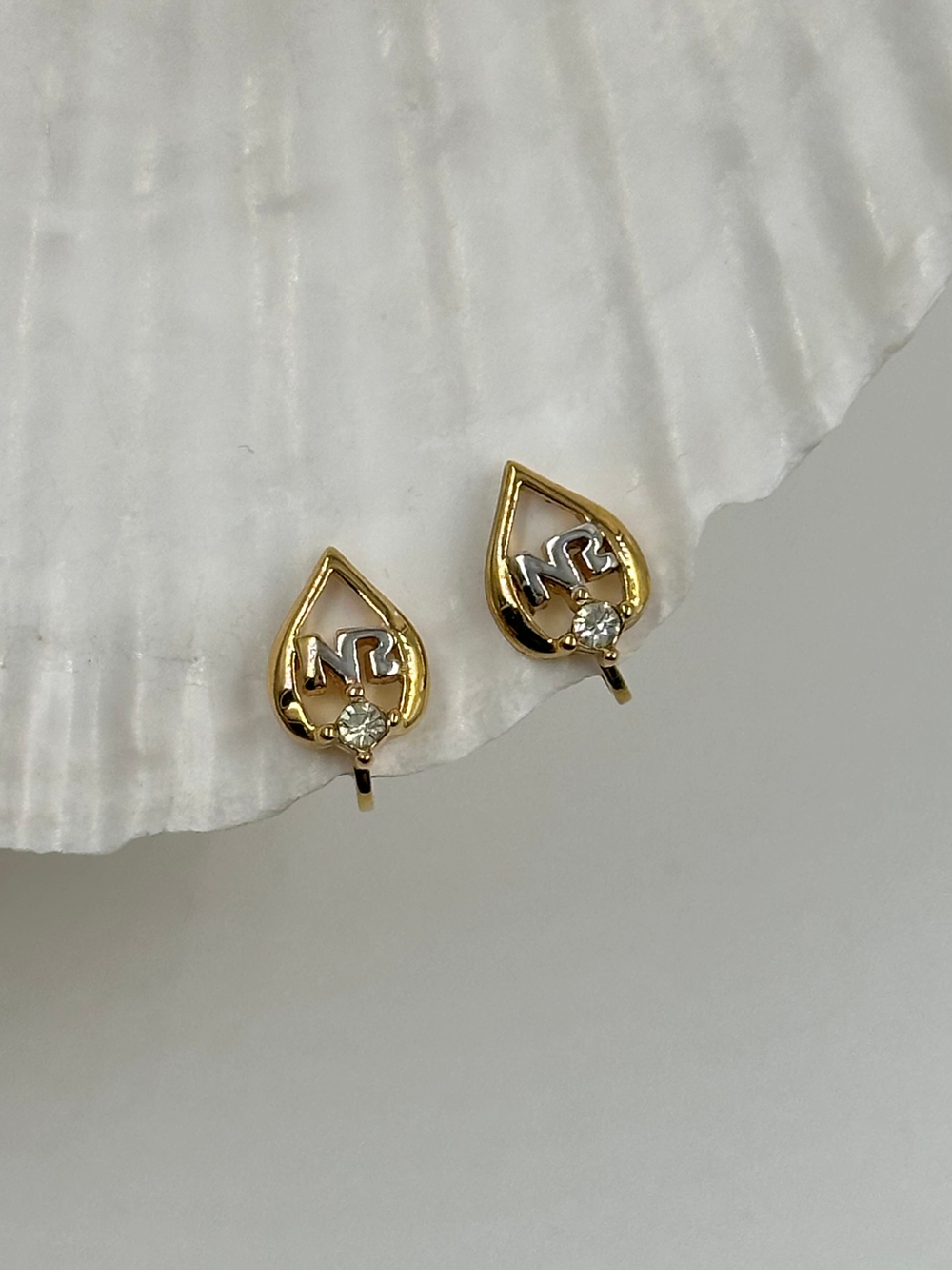 Миниатюрные клипсы Nina Ricci