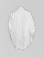 Рубашка однотонная удлиненная сзади и с рукавами расклешенными к низу