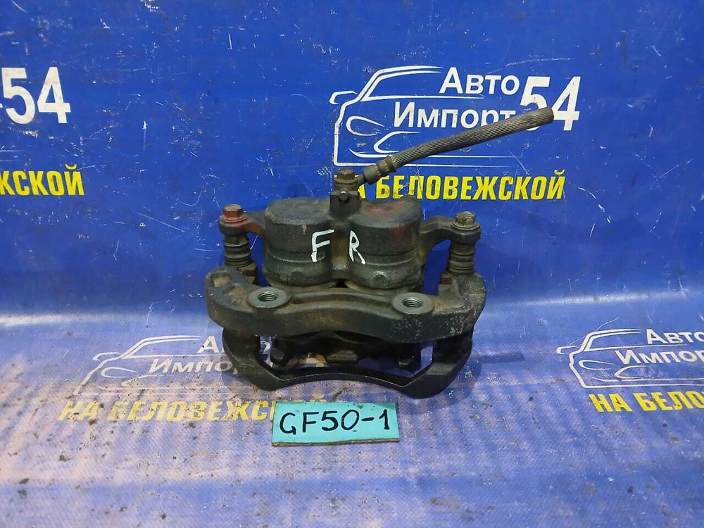 Суппорт тормозной передний правый NISSAN CIMA 2002