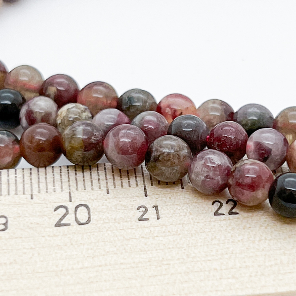 Турмалин, диаметр 6-6,2 мм, цена за 32-33 шт (1/2 нити)