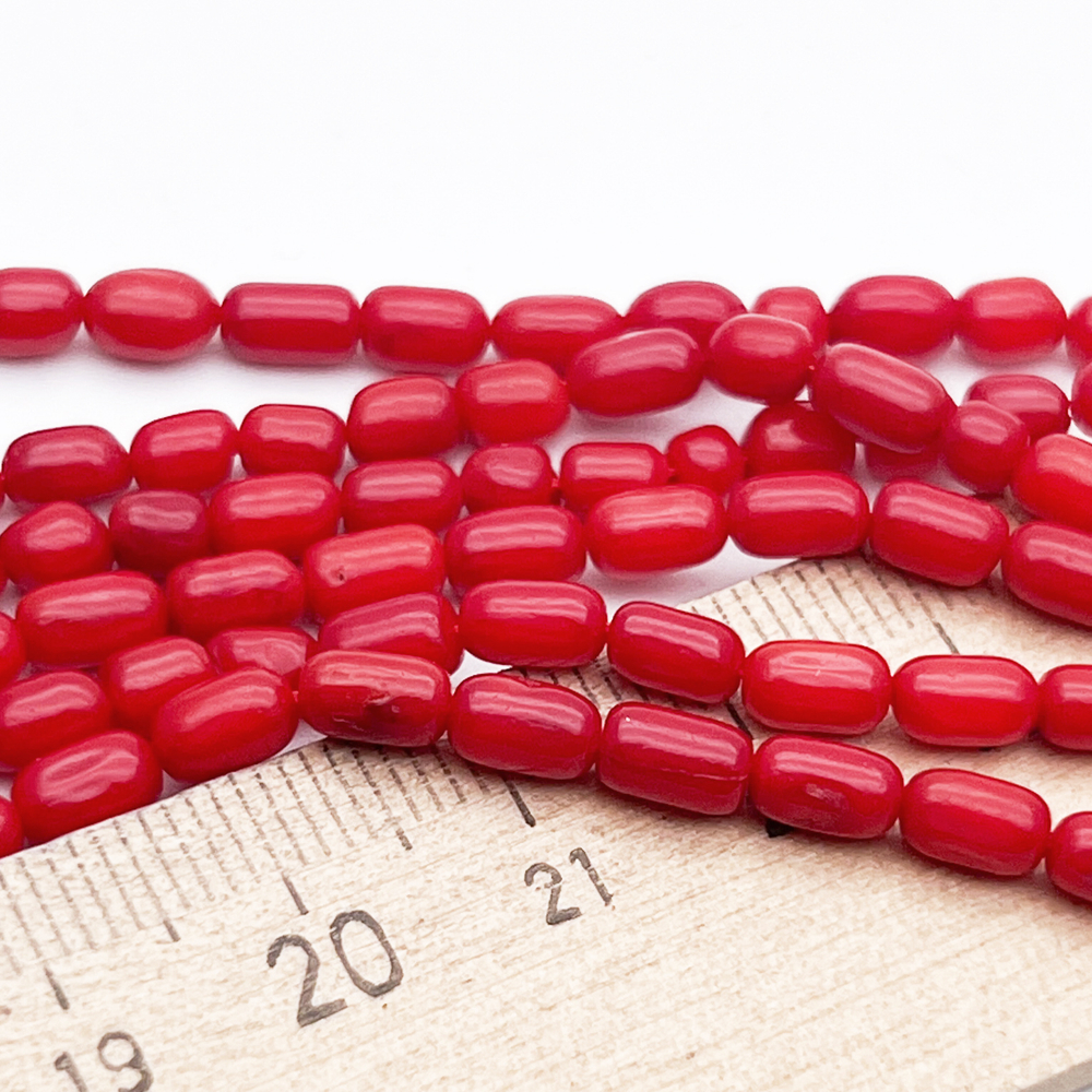 Коралл тонированный бусины, размер около 6*3,5 мм, цена за отрезок 19 см (1/2 нити)