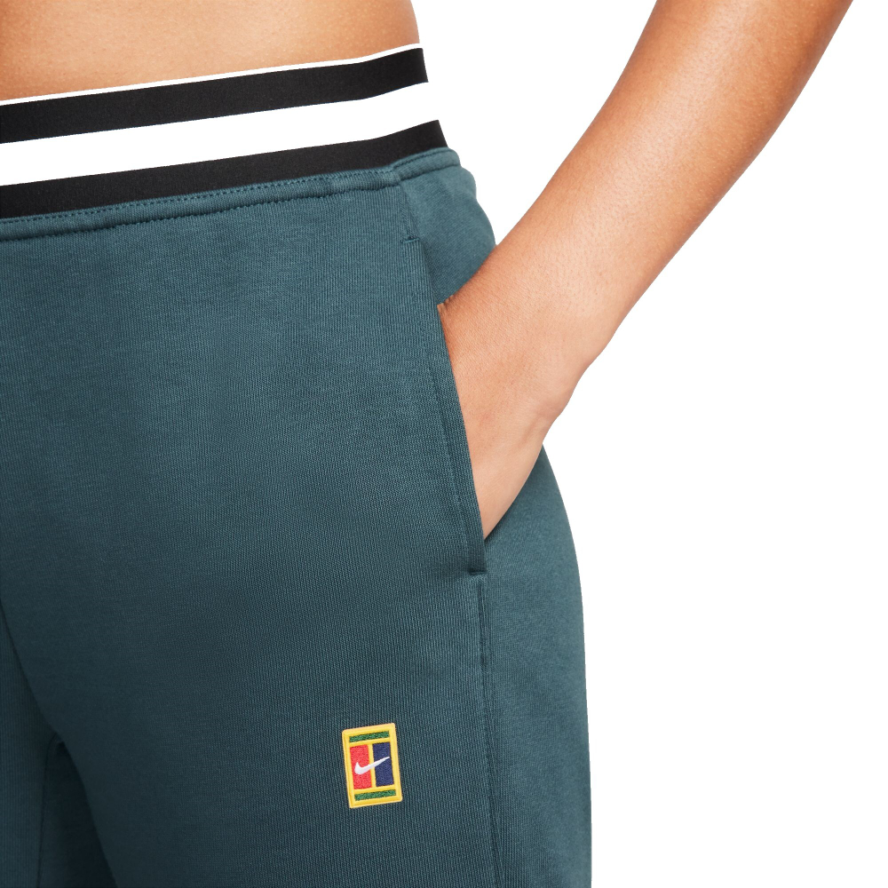 Женские теннисные брюки Nike Dri-Fit Heritage Core Fleece Pant - deep jungle