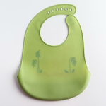 5231417 Нагрудник силиконовый, с карманом «Динозавр», цвет зеленый