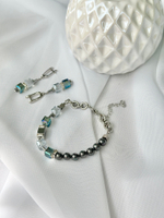 Браслет из радужных и дымчато-серых кристаллов Swarovski,темного жемчуга Майорка и гематита, серебро