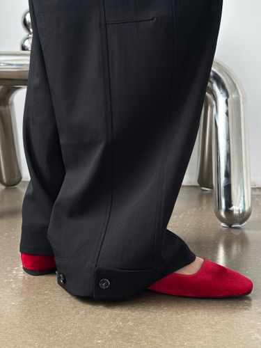 Широкие черные брюки с застежками по низу