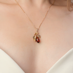 Подвеска «Барбарис» из красного золота с янтарём и эмалью