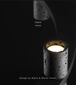 Подвесная люстра из чёрного травертина с кольцевой формой.