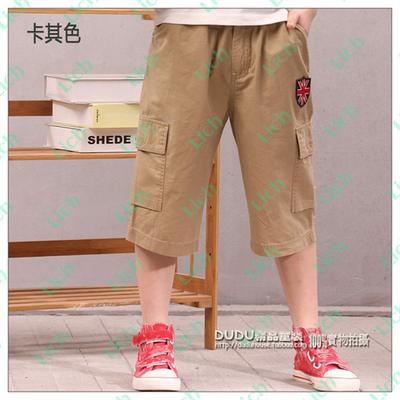 Капри однотонные с четырьмя накладными карманами и вышивкой