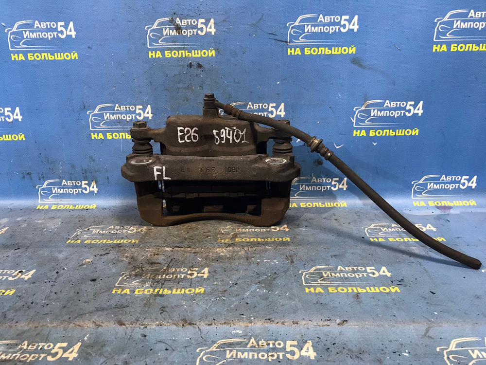 Суппорт тормозной передний левый NISSAN CARAVAN 2012-2017