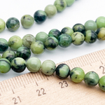 Серпентин бусины, диаметр около 6-6,1 мм, цена за 32-33 шт (1/2 нити)