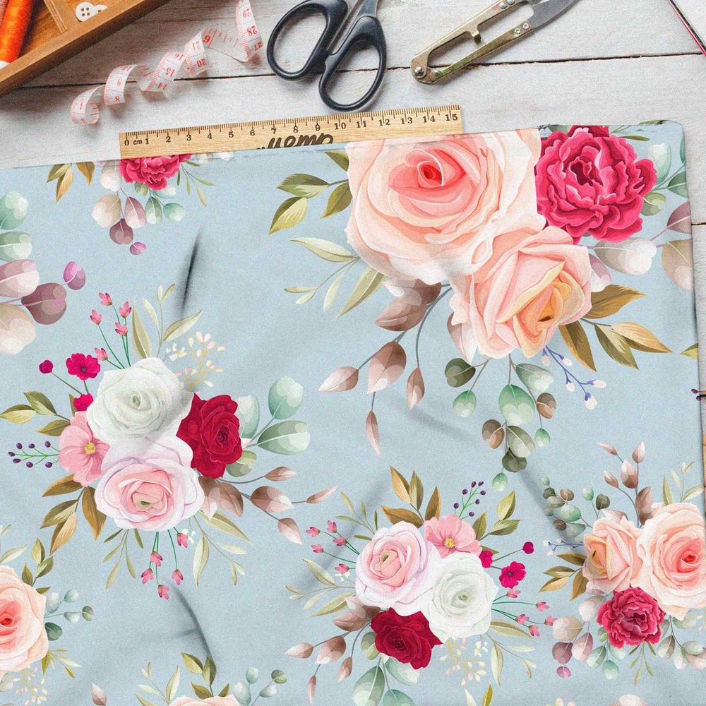 Ткань кулирная гладь розы на голубом